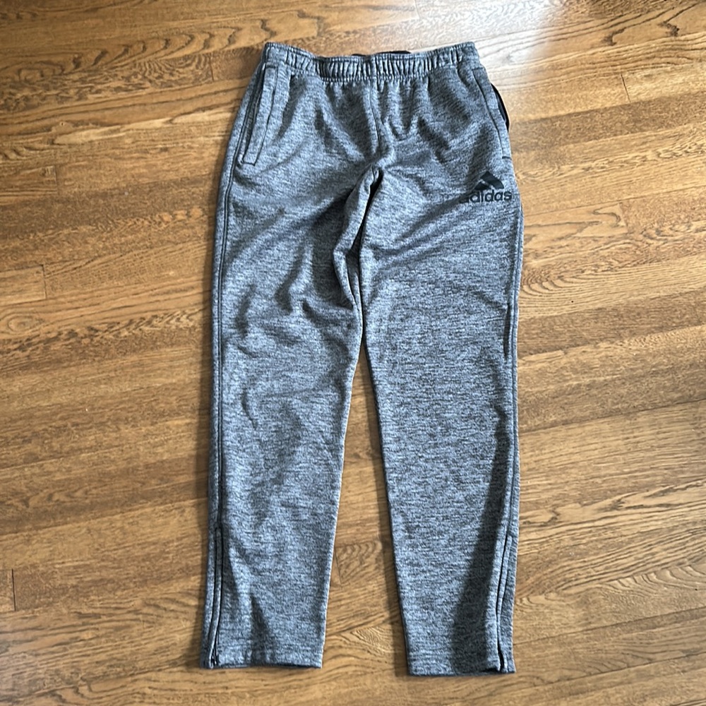 2 pairs of jogger style pants. 1- under armor and 1 adidas